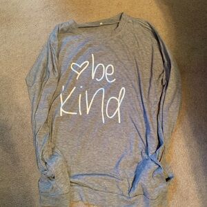 Ladies long sleeve shirt with “be kind” on the front, has pockets